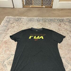 Fox Men's Black Tee with Yellow-Orange Gradient Logo